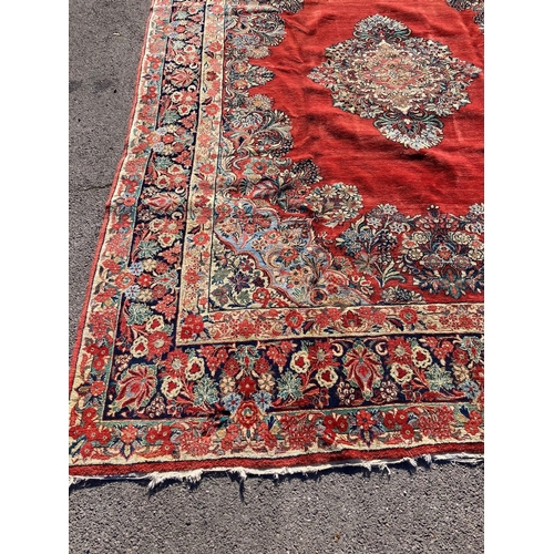 1120 - A large North West Persian red ground carpet, 361cm x 274cm