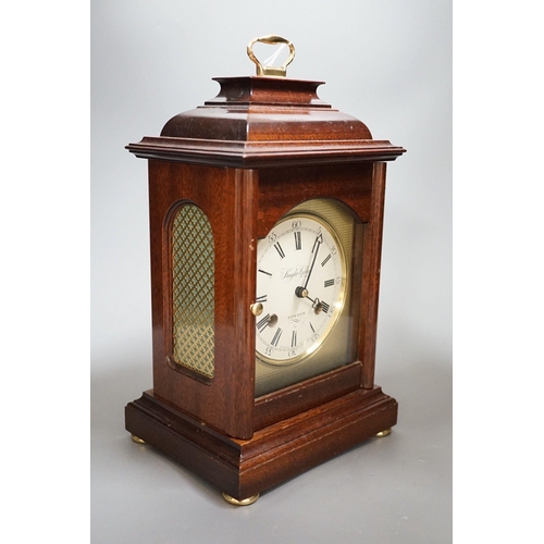Knight and Gibbins. A reproduction mantel clock, 30c high