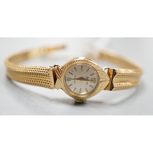 1935 - A lady's 9ct gold Accurist manual wind wrist watch, on a continental yellow metal bracelet, gross we... 