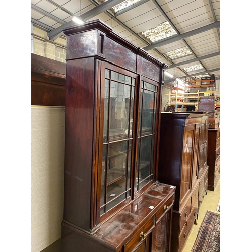 1002 - A Regency mahogany bookcase / cupboard, width 106cm, depth 44cm, height 226cm