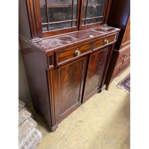 1002 - A Regency mahogany bookcase / cupboard, width 106cm, depth 44cm, height 226cm