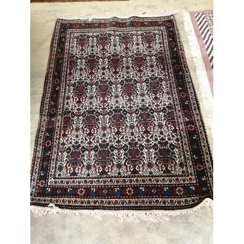 1004 - A North West Persian blue ground rug, 153 x 106cm