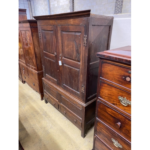 1005 - A mid 18th century oak press cupboard with two panelled doors and two drawers