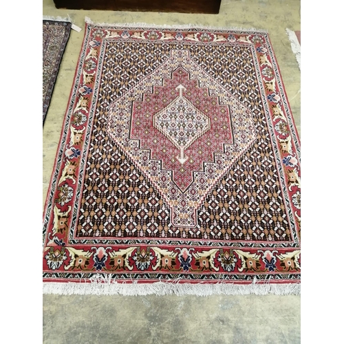 1009 - A North West Persian blue ground rug, 160 x 124cm