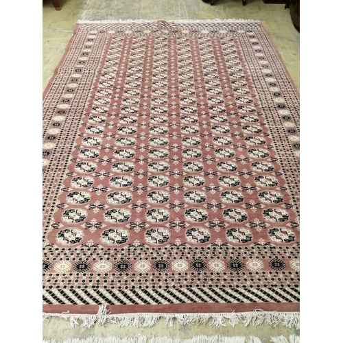 1016 - A pair of Bokhara peach ground carpets, 310 x 218cm