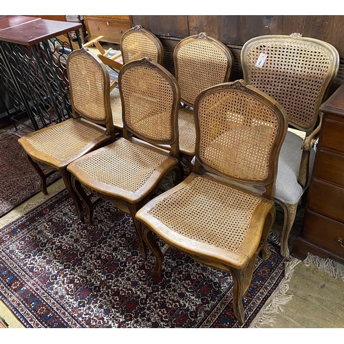 1042 - A set of five French carved beech dining chairs and a similar elbow chair