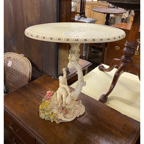 1043 - A 1950's Italian composite occasional table with figural cornucopia stem, width 49cm, depth 35cm, he... 