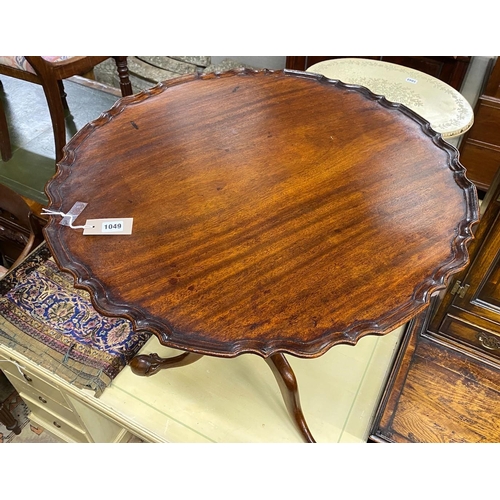 1049 - A George III and later circular mahogany tilt top piecrust tea table, diameter 72cm, height 73cm... 