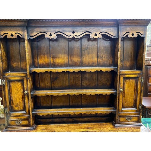 1051 - An 18th century style mahogany banded oak potboard dresser with boarded rack, width 167cm, depth 48c... 