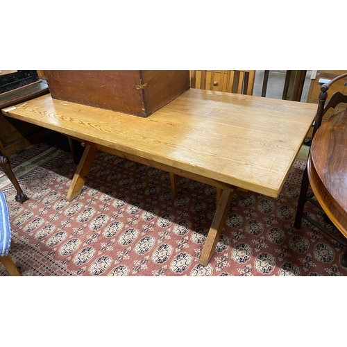 1061 - A rectangular pitch pine tavern type refectory dining table, length 182cm, width 86cm, height 73cm a... 