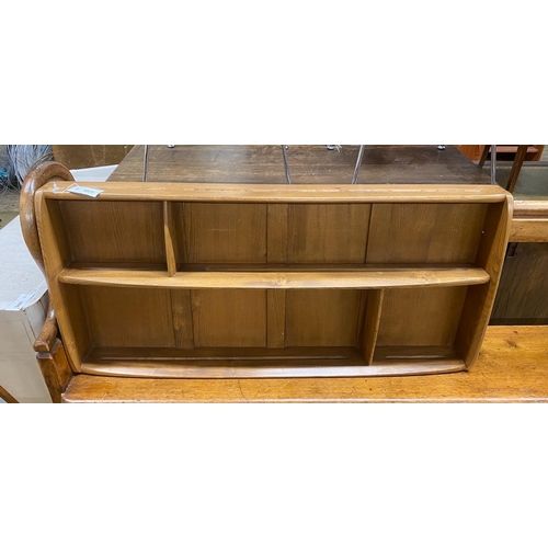 1071 - An Ercol elm plate rack, width 107cm, depth 13cm, height 49cm