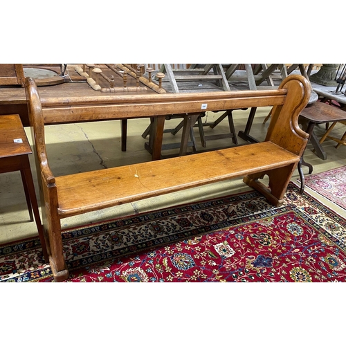 1072 - A Victorian pine pew, length 174cm