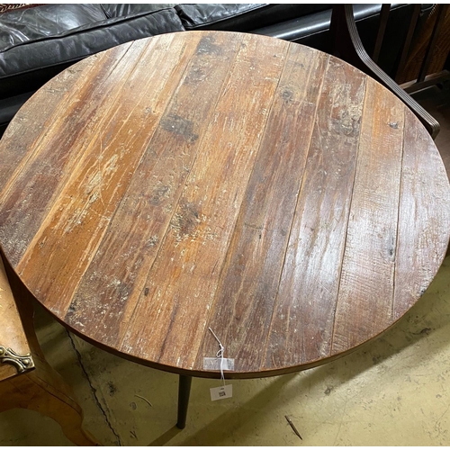 1075 - A teak top circular table with metal underframe, diameter 91cm, height 74cm