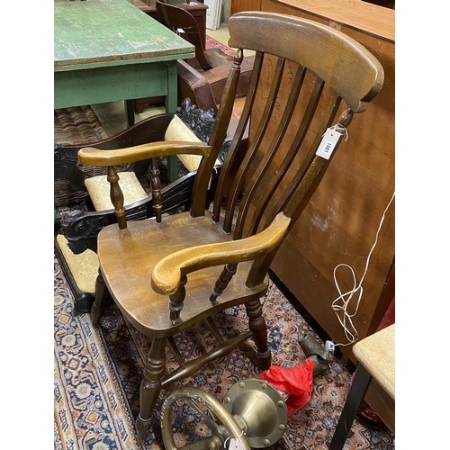 1081 - A Victorian style beech lathe back Windsor armchair, width 63cm, height 116cm