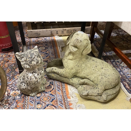 1084 - Two reconstituted stone garden ornaments, recumbent hound and seated cat, larger height 34cm