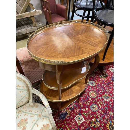 1115 - A pair of French style glass mounted mahogany oval occasional tables, width 54cm, height 62cm