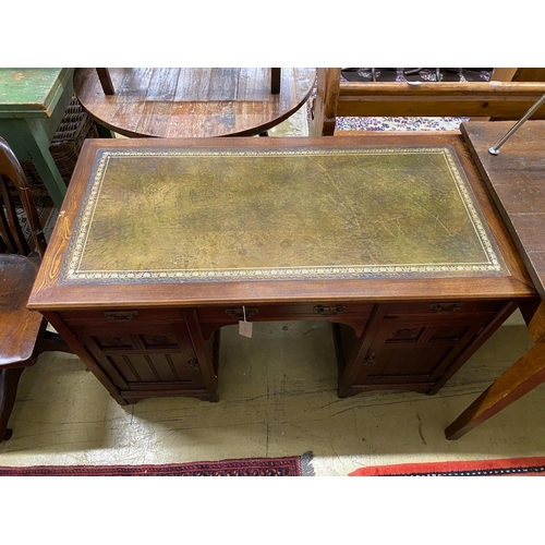 1116 - A late Victorian Aesthetic movement oak kneehole writing table, width 120cm, depth 60cm, height 74cm... 