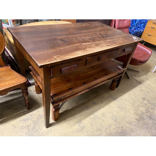 1118 - A mid century oak writing table with planked top and three drawers, length 130cm, depth 78cm, height... 