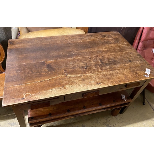 1118 - A mid century oak writing table with planked top and three drawers, length 130cm, depth 78cm, height... 