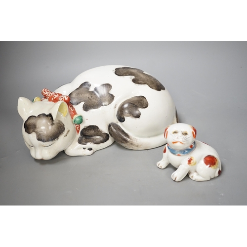 1340 - A Japanese Arita cat and a smaller pottery cat. Largest 25cm wide