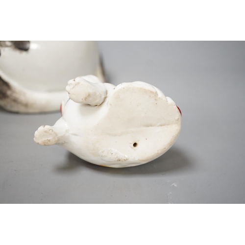 1340 - A Japanese Arita cat and a smaller pottery cat. Largest 25cm wide