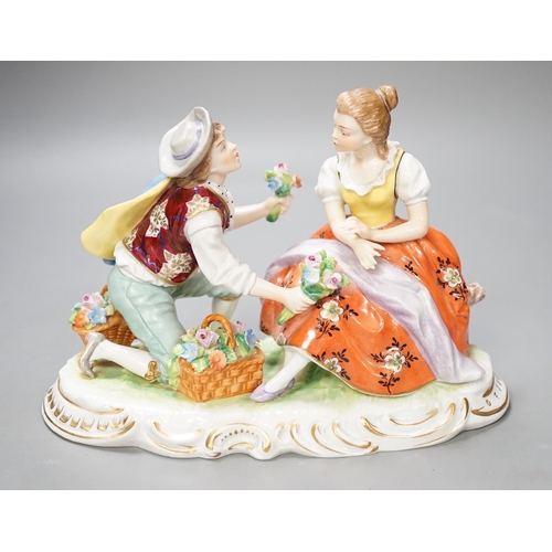 1353 - A Sitzendorf porcelain figure group of a romance. 13cm high