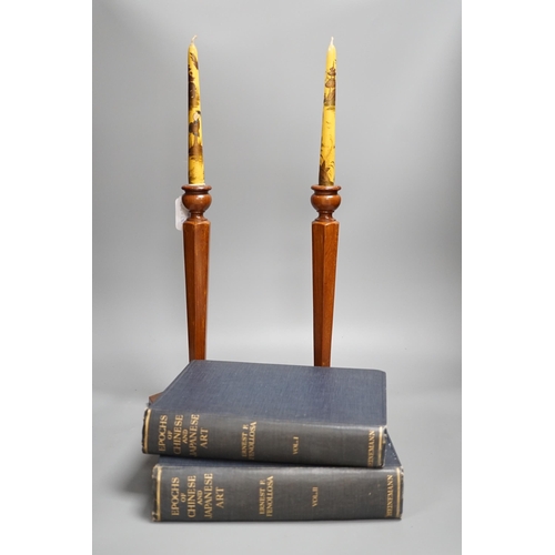 1355 - A pair of hexagonal fruitwood candlesticks with chinoiserie faux candles and two volumes on Japanese... 