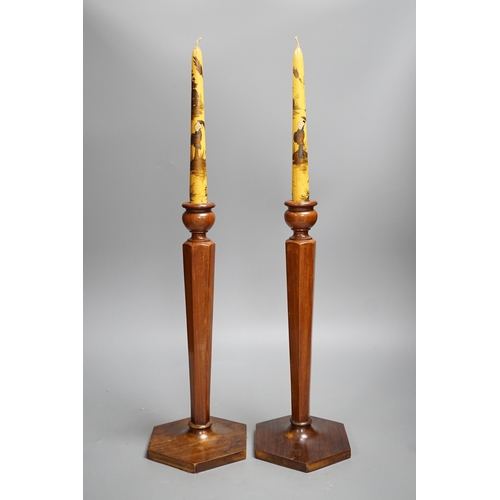 1355 - A pair of hexagonal fruitwood candlesticks with chinoiserie faux candles and two volumes on Japanese... 