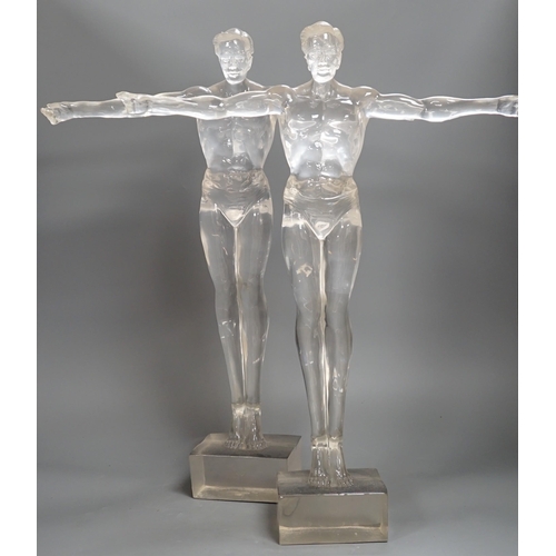 1357 - A pair of clear perspex models of male swimmers, 57cms high,