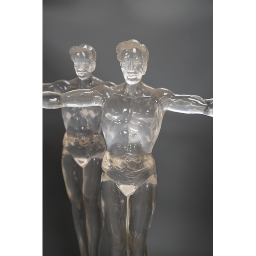 1357 - A pair of clear perspex models of male swimmers, 57cms high,