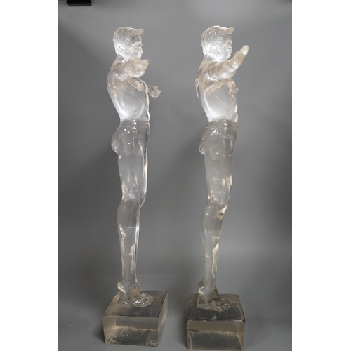 1357 - A pair of clear perspex models of male swimmers, 57cms high,