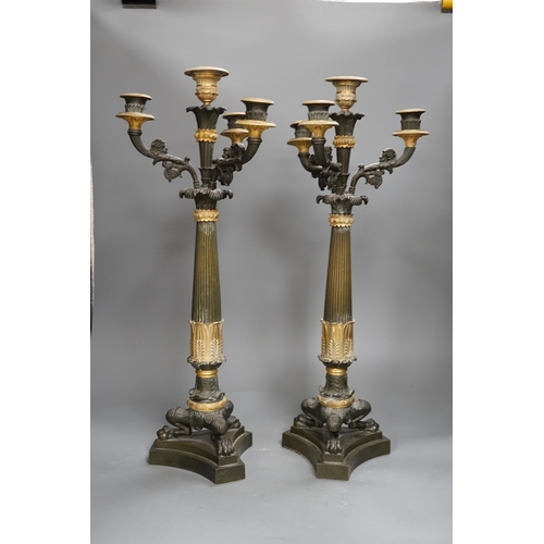 1358 - A pair of 19th century French Empire style bronze and gilt metal three branch, four light candelabra... 