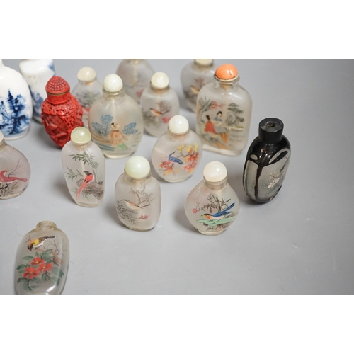 1457 - A collection of 20th century Chinese export reverse painted snuff bottles with associated blue and w... 