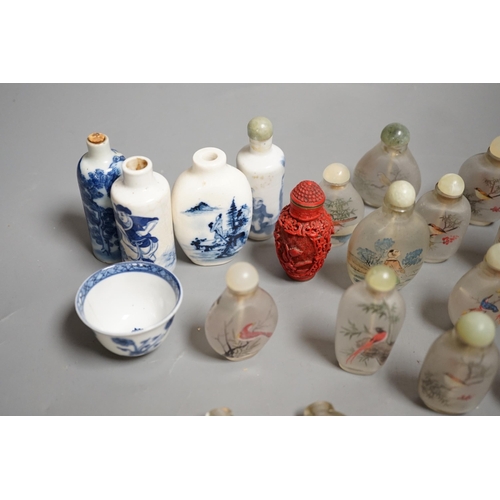 1457 - A collection of 20th century Chinese export reverse painted snuff bottles with associated blue and w... 