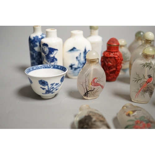 1457 - A collection of 20th century Chinese export reverse painted snuff bottles with associated blue and w... 