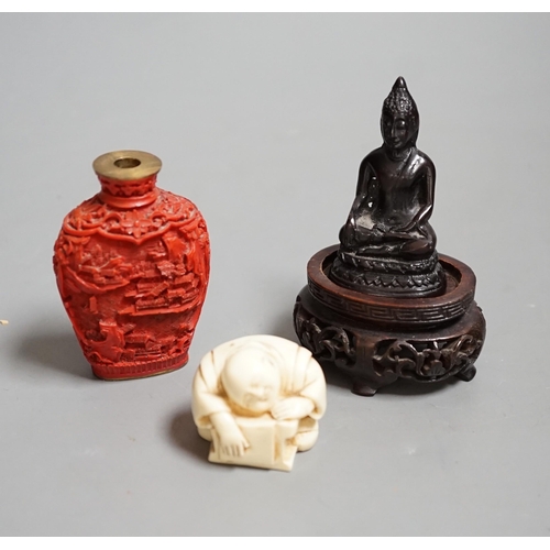 1462 - A Chinese resin snuff bottle, a resin Buddha on stand and a resin netsuke