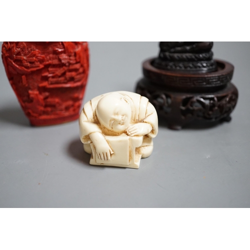 1462 - A Chinese resin snuff bottle, a resin Buddha on stand and a resin netsuke