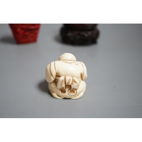 1462 - A Chinese resin snuff bottle, a resin Buddha on stand and a resin netsuke