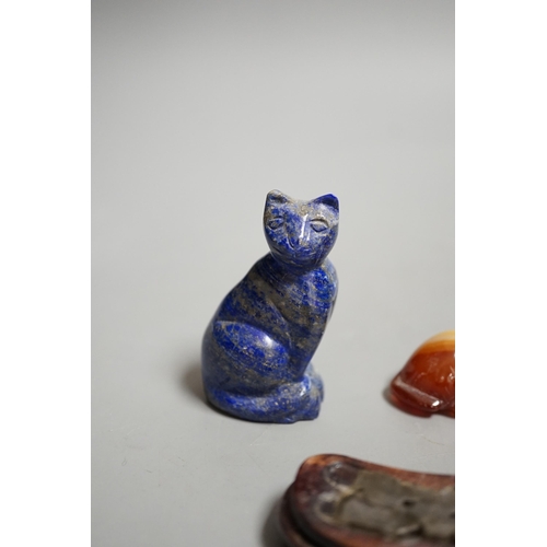 1463 - A Chinese carved lapis lazuli seated cat, a banded agate recumbent cat on hardwood stand and a white... 