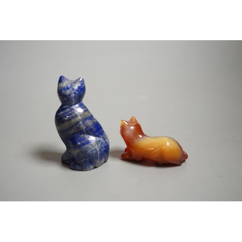 1463 - A Chinese carved lapis lazuli seated cat, a banded agate recumbent cat on hardwood stand and a white... 