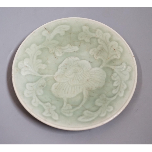 1464 - A Chinese carved celadon dish, Qing dynasty, 15cm diameter