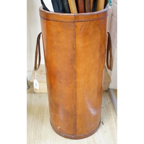 1471 - A cylindrical leather stick stand, 60cms high