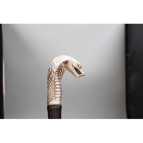 1477 - A Jeffery West umbrella with silver cobra handle,94cmslong