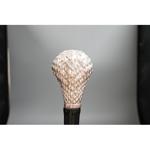 1477 - A Jeffery West umbrella with silver cobra handle,94cmslong