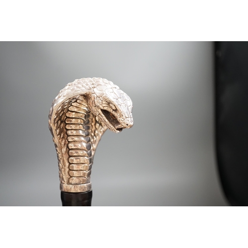 1477 - A Jeffery West umbrella with silver cobra handle,94cmslong