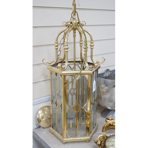 1479 - A hexagonal brass and bevelled glass hall lantern, 70 cms high,