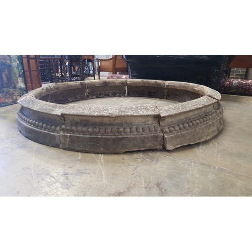 1001 - A reconstituted stone circular sectional garden planter, each segment width 68cm, height 28cm