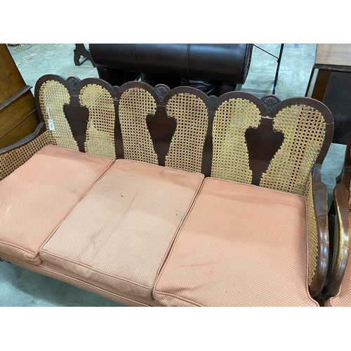 121 - A 1920's caned beech two piece bergere suite, settee length 168cm, depth 72cm, height 82cm