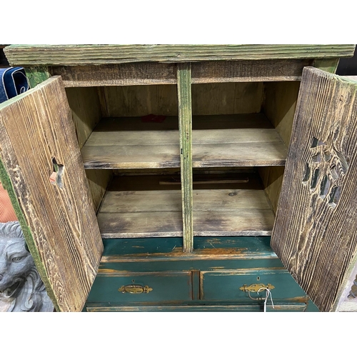 123 - A small Gothic style painted pine two door cupboard, width 66cm, depth 41cm, height 57cm