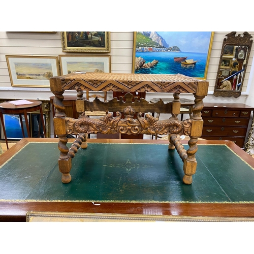 158 - A Jacobean revival caned carved beech stool width 59cm, height 46cm.